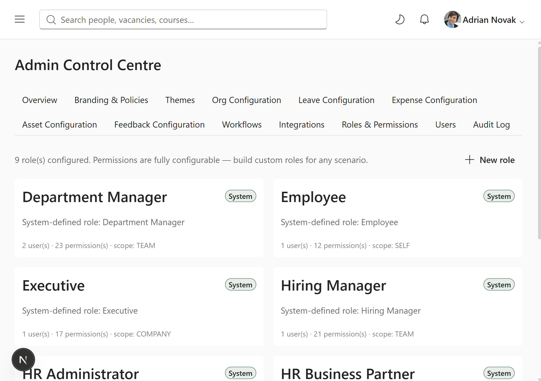 Roles & Permissions screen listing configured roles with user and permission counts
