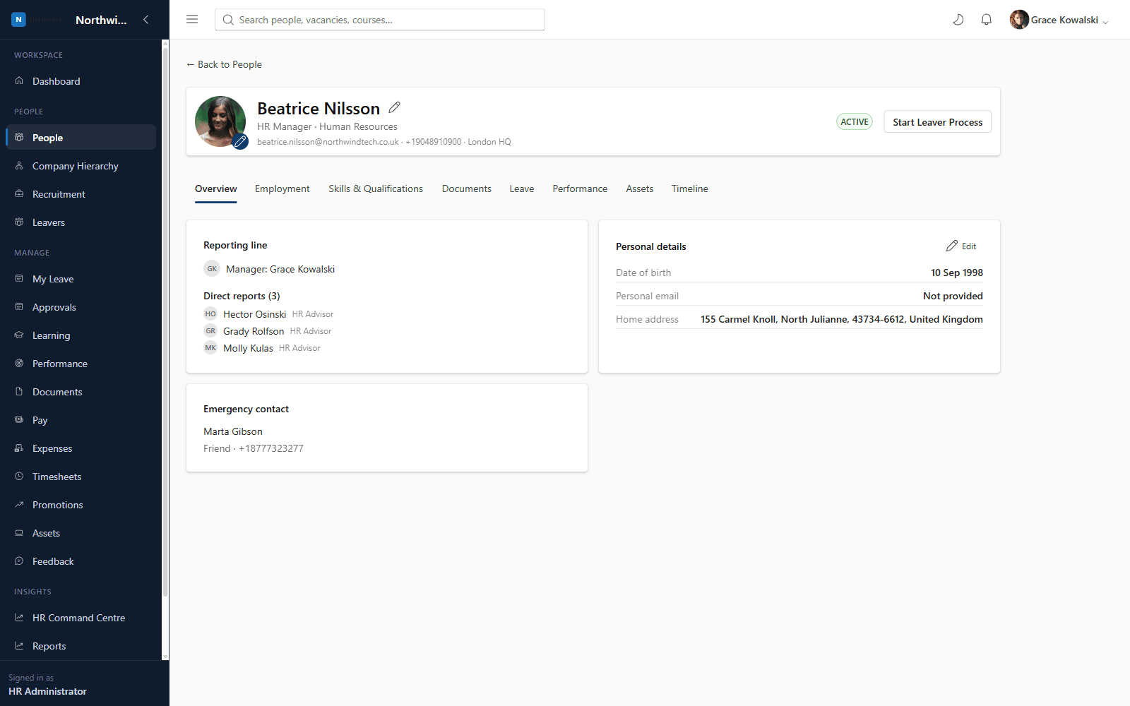 Employee profile screen showing personal details, reporting line and direct reports
